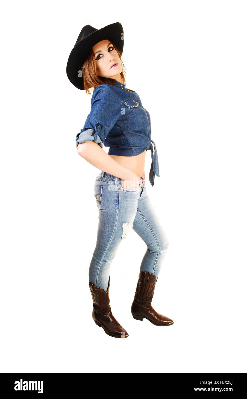 Girl standing as cowgirl Stock Photo - Alamy