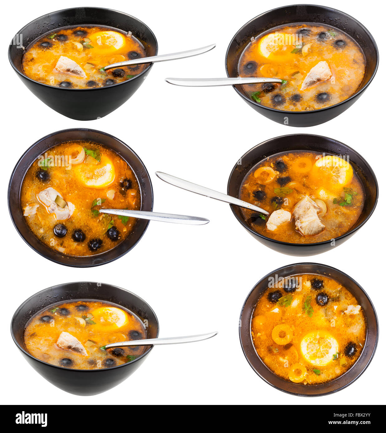 set of bowls with Solyanka russian traditional spicy and sour soup with fish isolated on white background Stock Photo