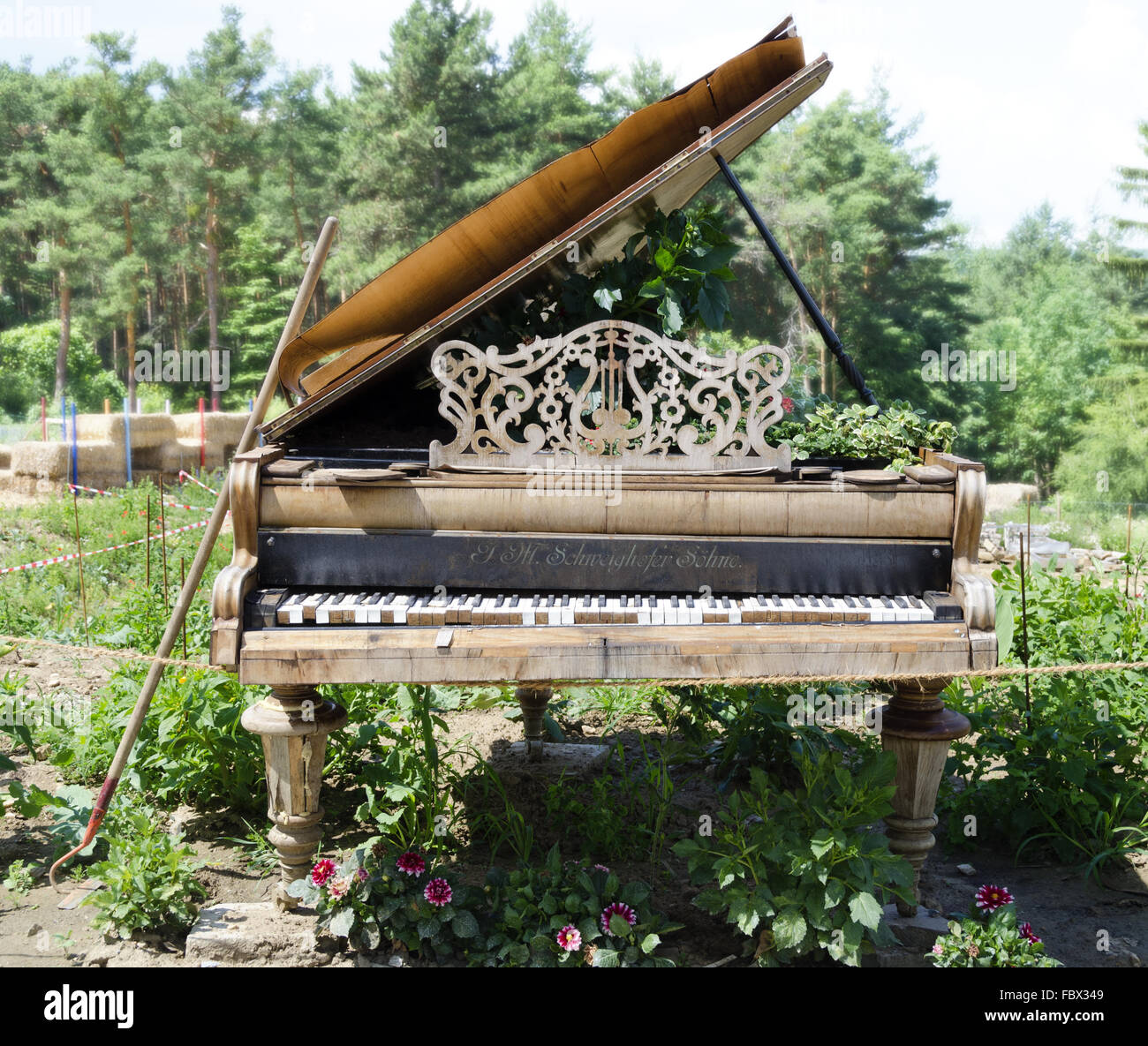 old desolate piano in a garden Stock Photo