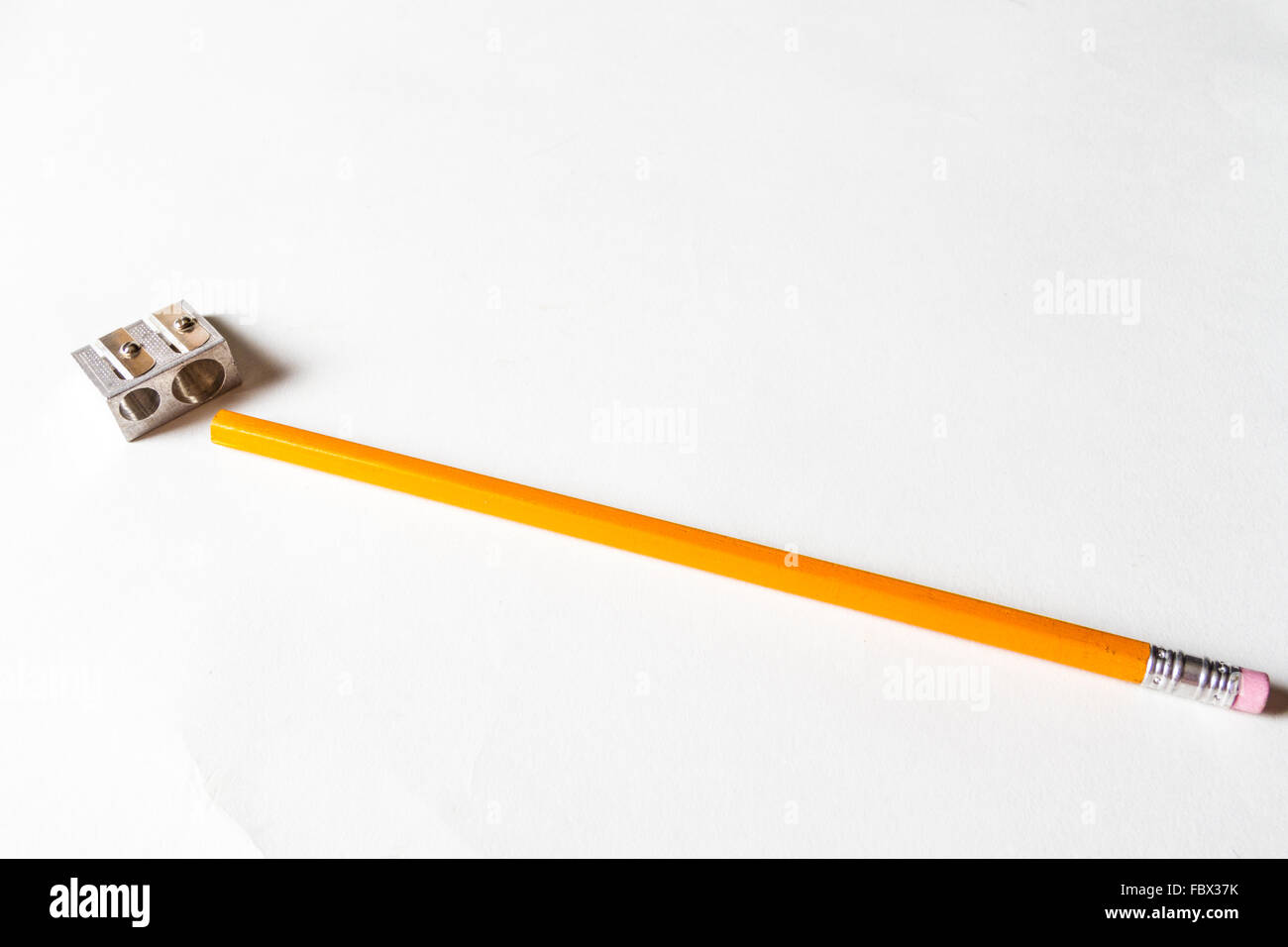 A yellow pencil and sharpener Stock Photo