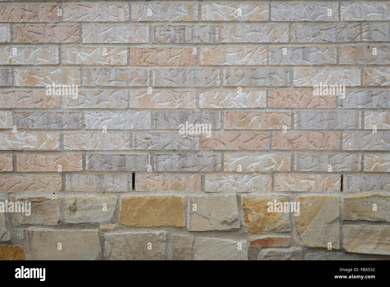 background of random brown tone brick wall over big rock, pattern Stock Photo