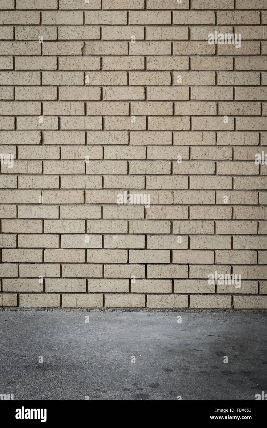 orange brick wall background intersect concrete floor Stock Photo