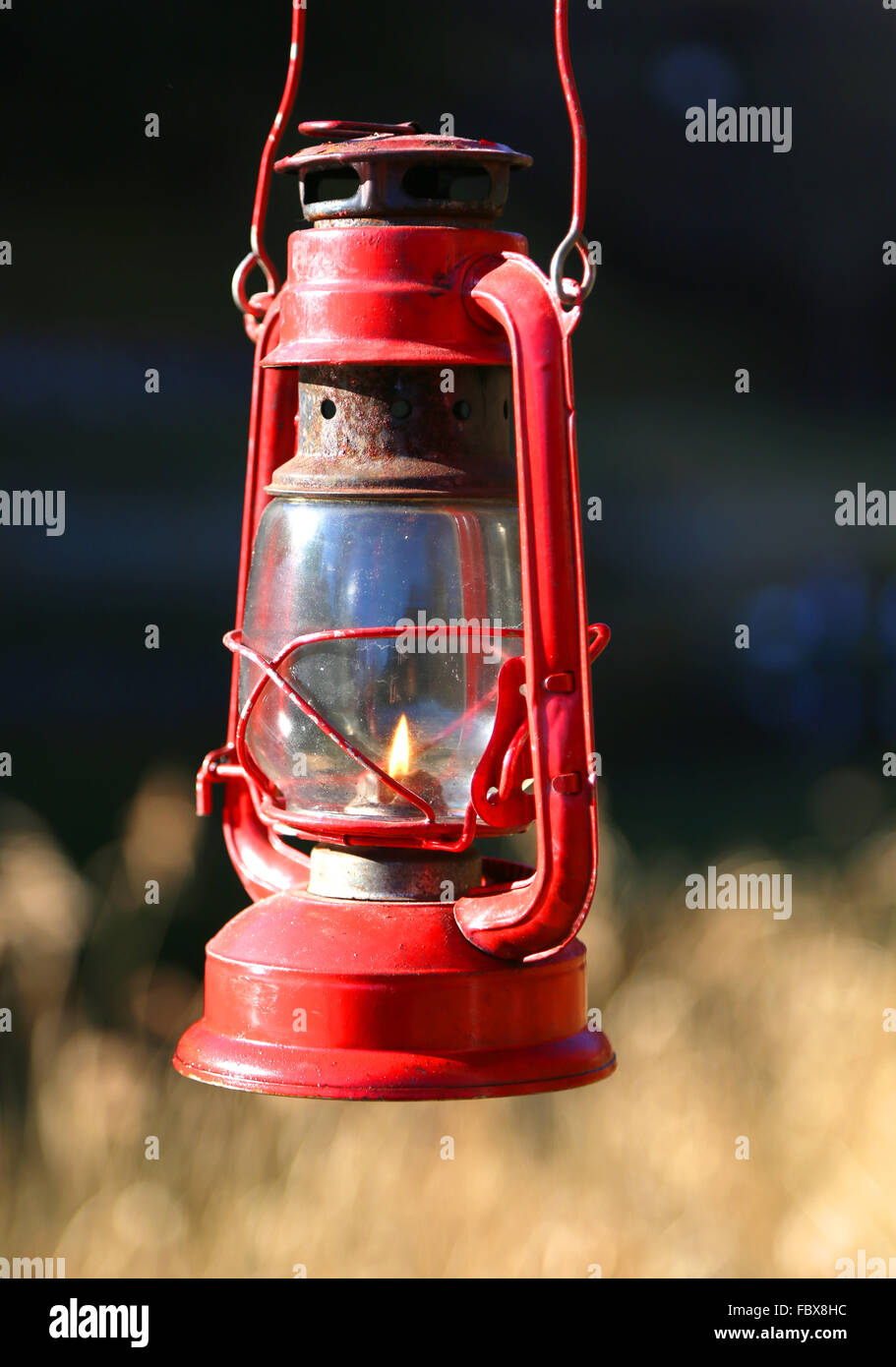 vintage old red lamp oil with flame Stock Photo Alamy