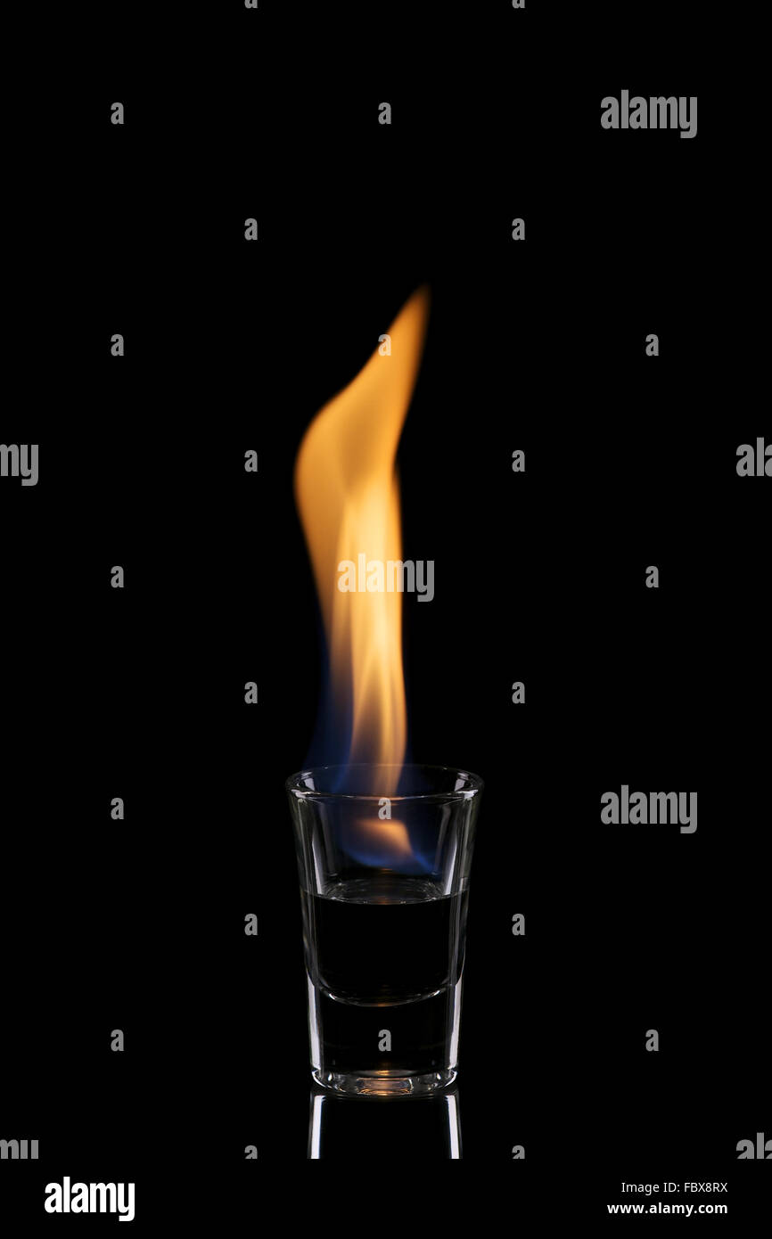 Glass with burning alcohol Stock Photo