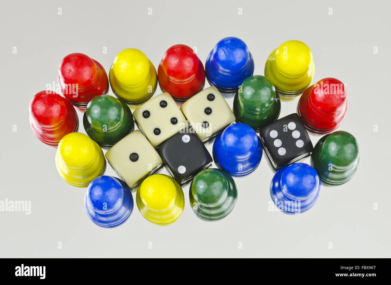 five dices and 16 cones with four colours Stock Photo