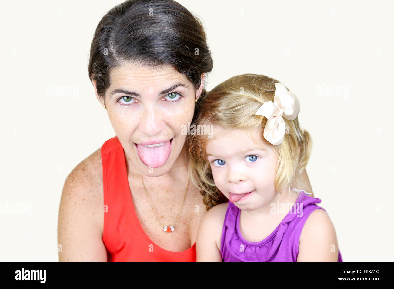 Mother And Daughter Making Silly Faces Stock Photo