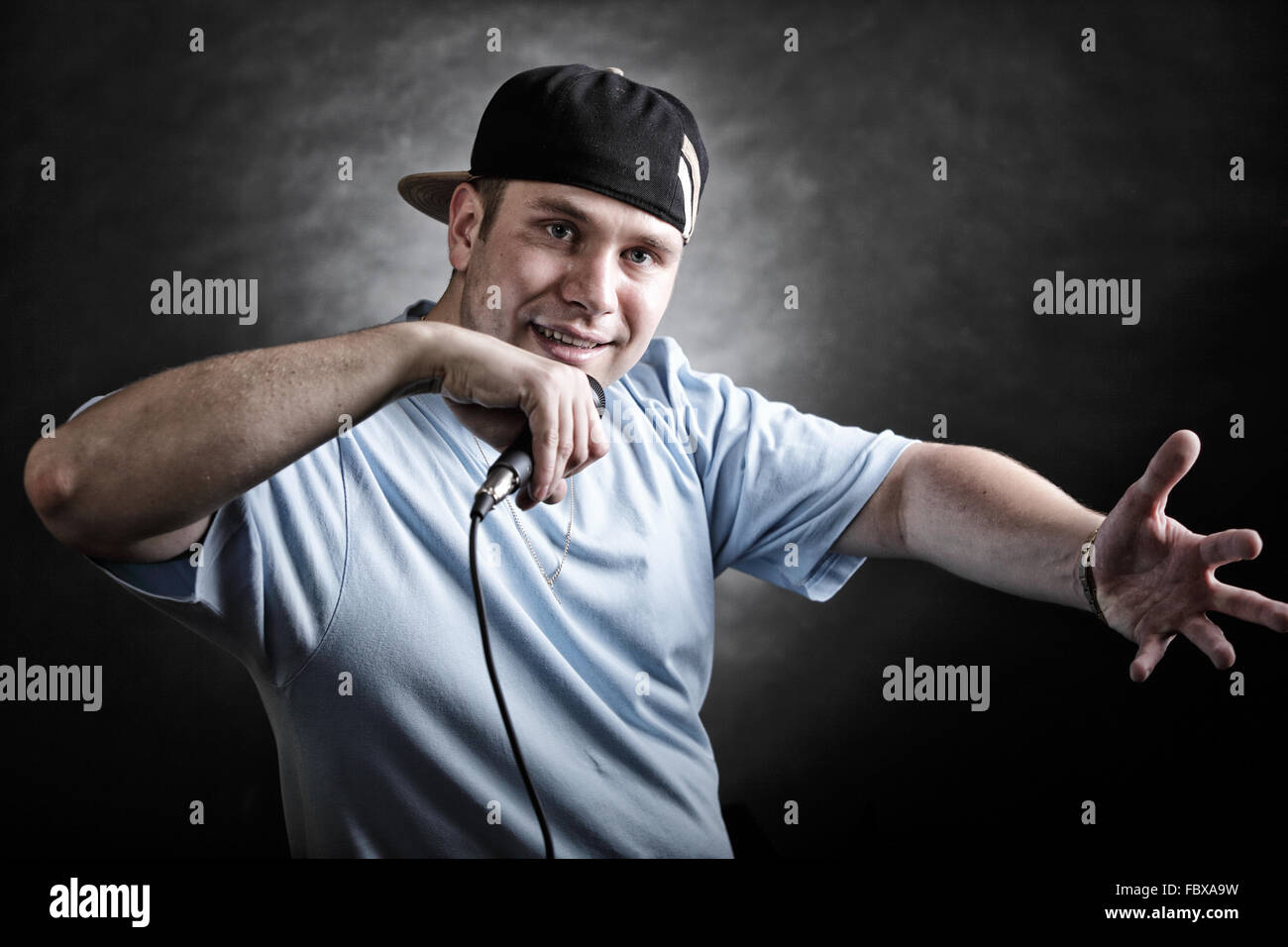 Rap singer man with microphone cool hand gesture Stock Photo Alamy