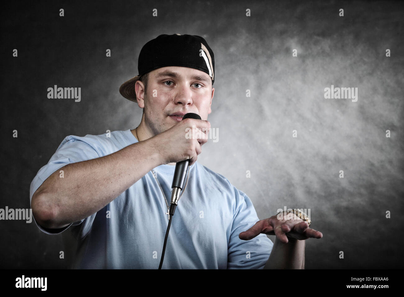 Rap singer man with microphone cool hand gesture Stock Photo Alamy
