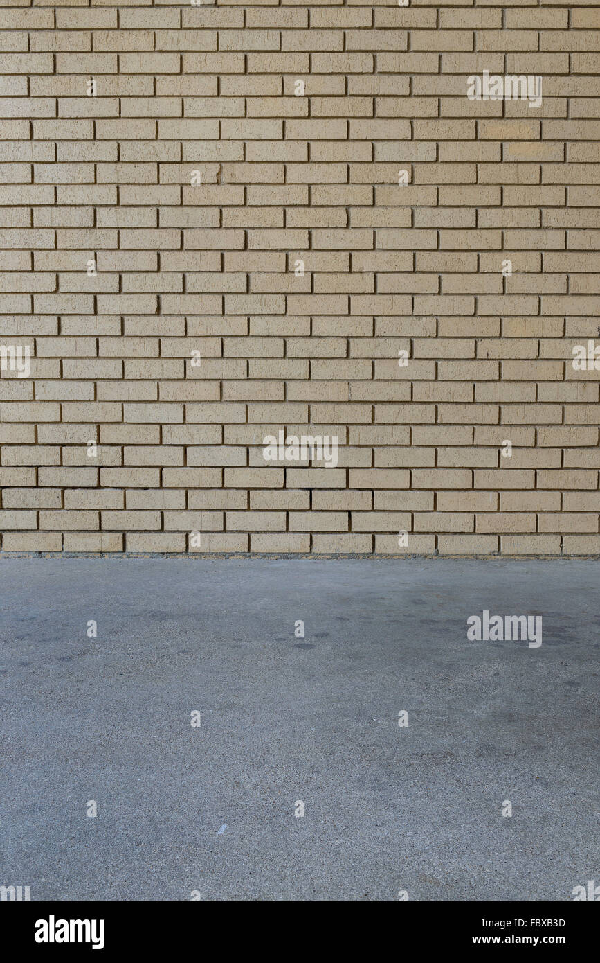 orange brick wall background intersect concrete floor Stock Photo