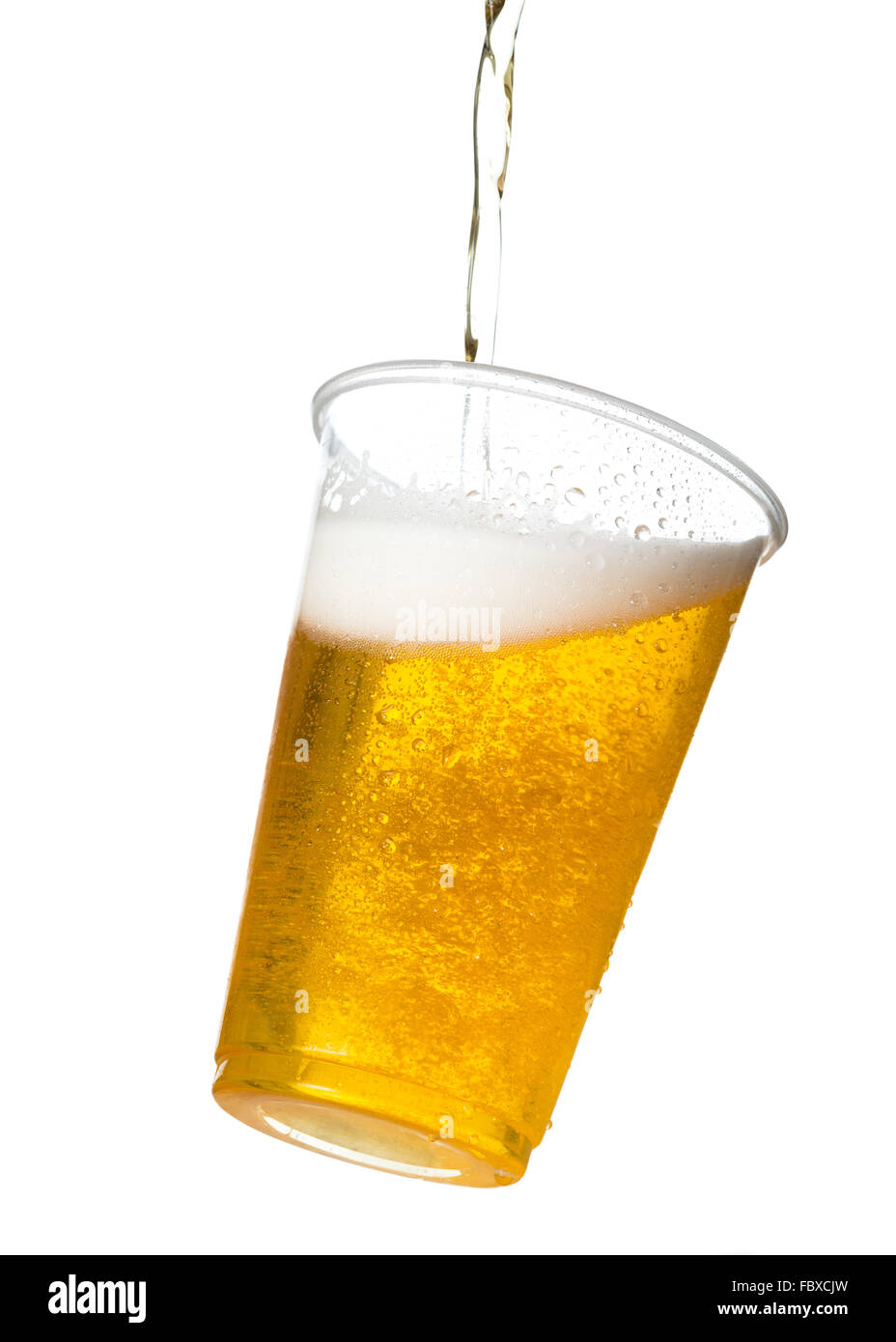 Golden lager or beer in disposable plastic cup Stock Photo - Alamy