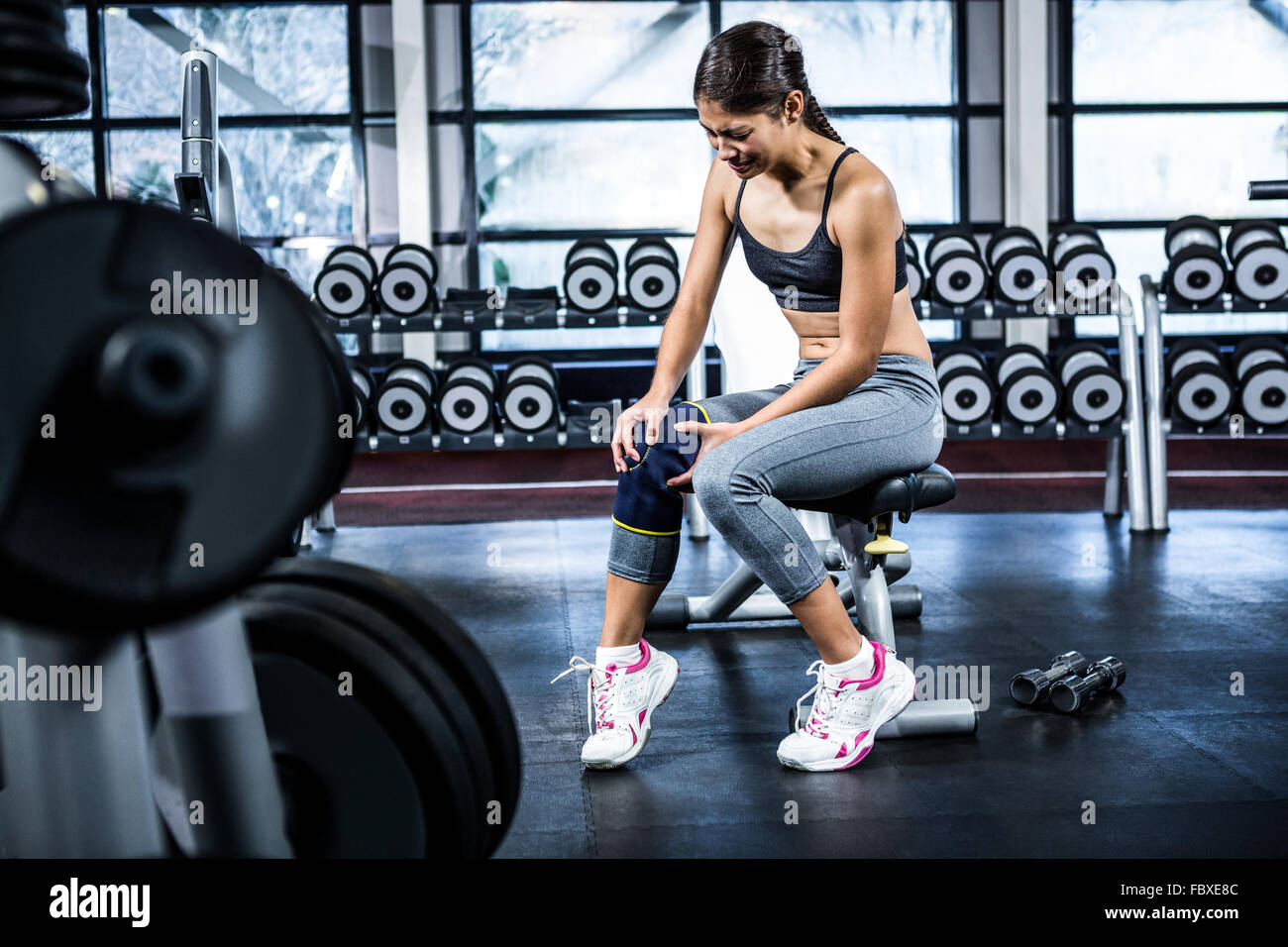 Fit woman having knees pain Stock Photo