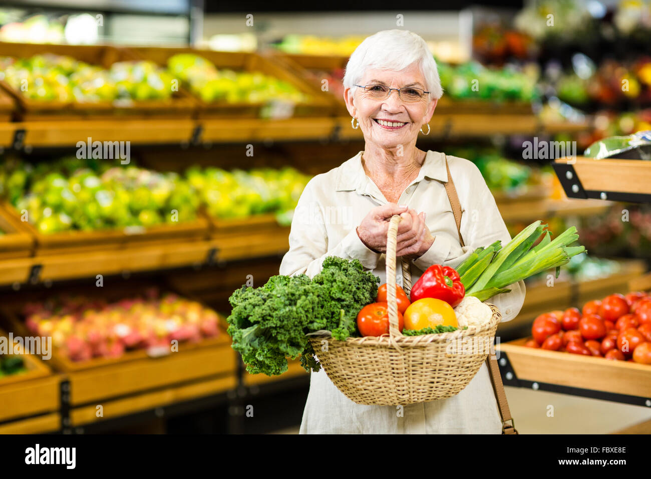 Woman holding wicker basket hi-res stock photography and images - Alamy