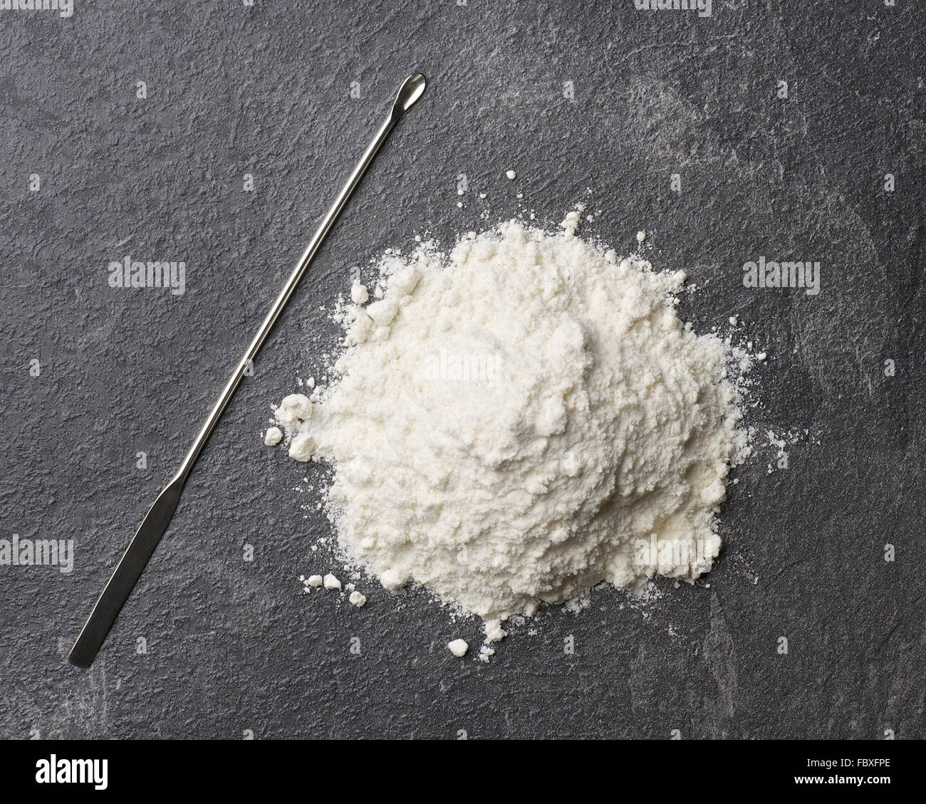 Spatula and White Powder Stock Photo