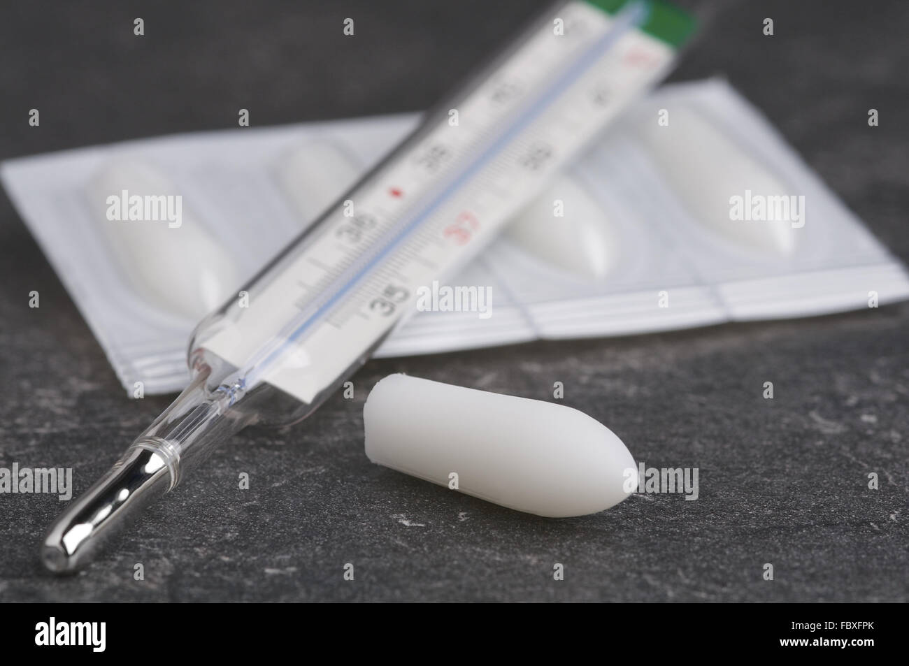 Suppository and Clinical Thermometer Stock Photo
