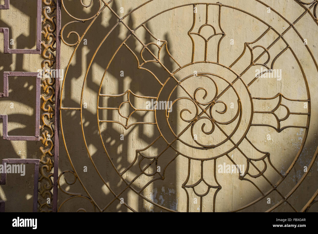 An ornate front gate showing Buddhist Auspicious symbol at  the small Monastery in town,  Bomdila, Arunachal Pradesh, India. Stock Photo