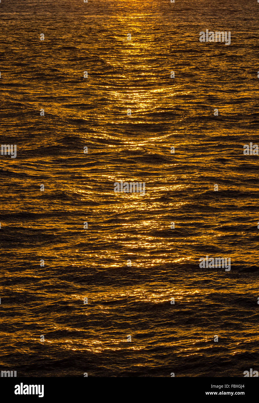 Sun Ripples Pattern of ripples in the ocean reflecting sun Stock Photo - Alamy