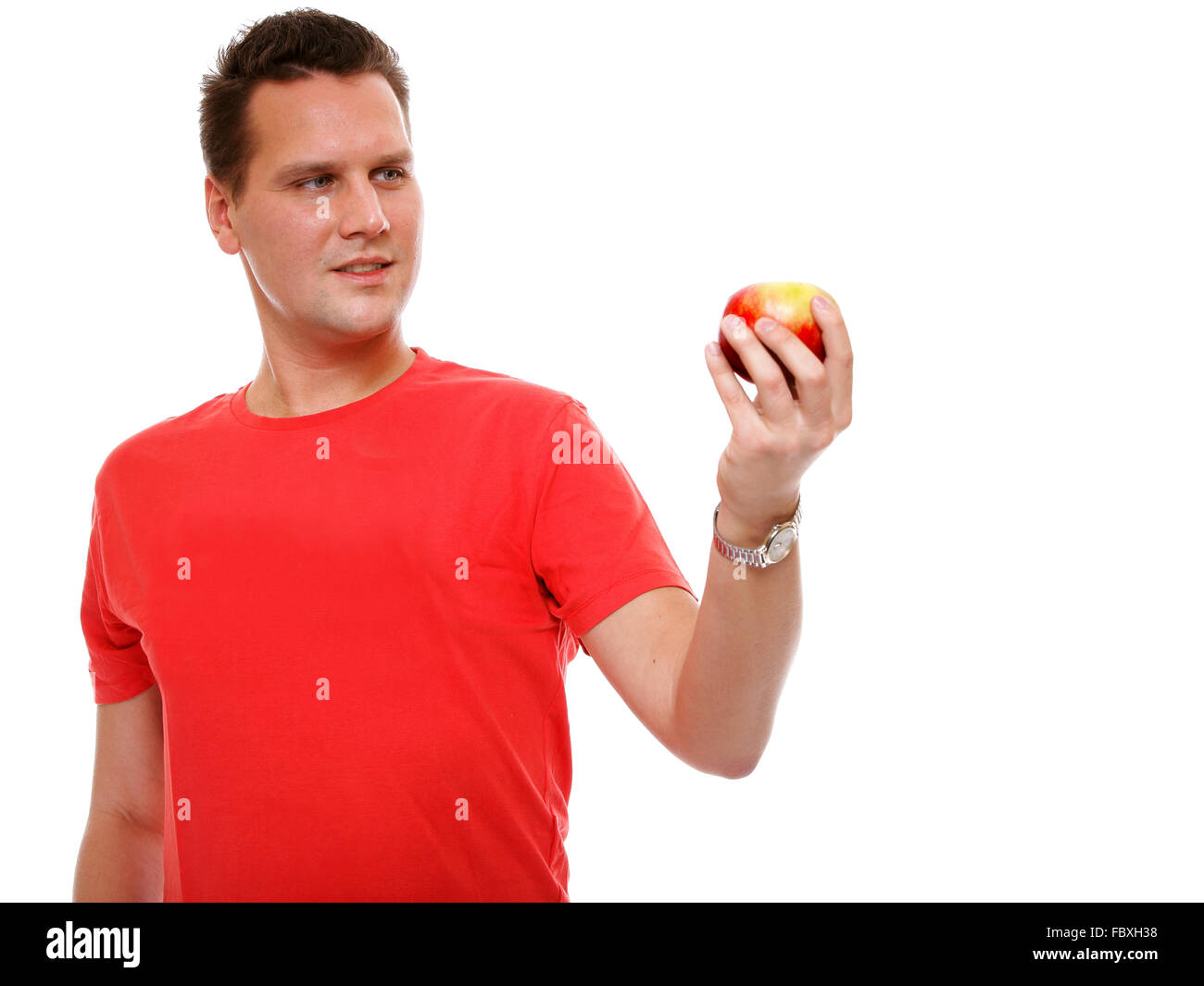 Handsome Man In Red Shirt With Apple Isolated Stock Photo Alamy