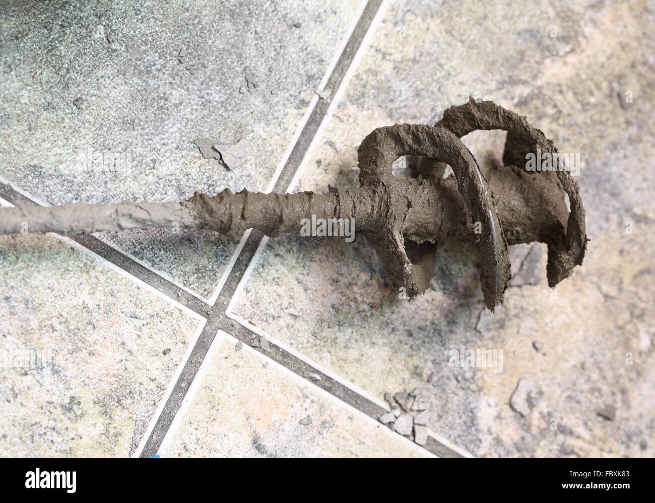 mixing Tile adhesive or cement with a power drill Stock Photo Alamy