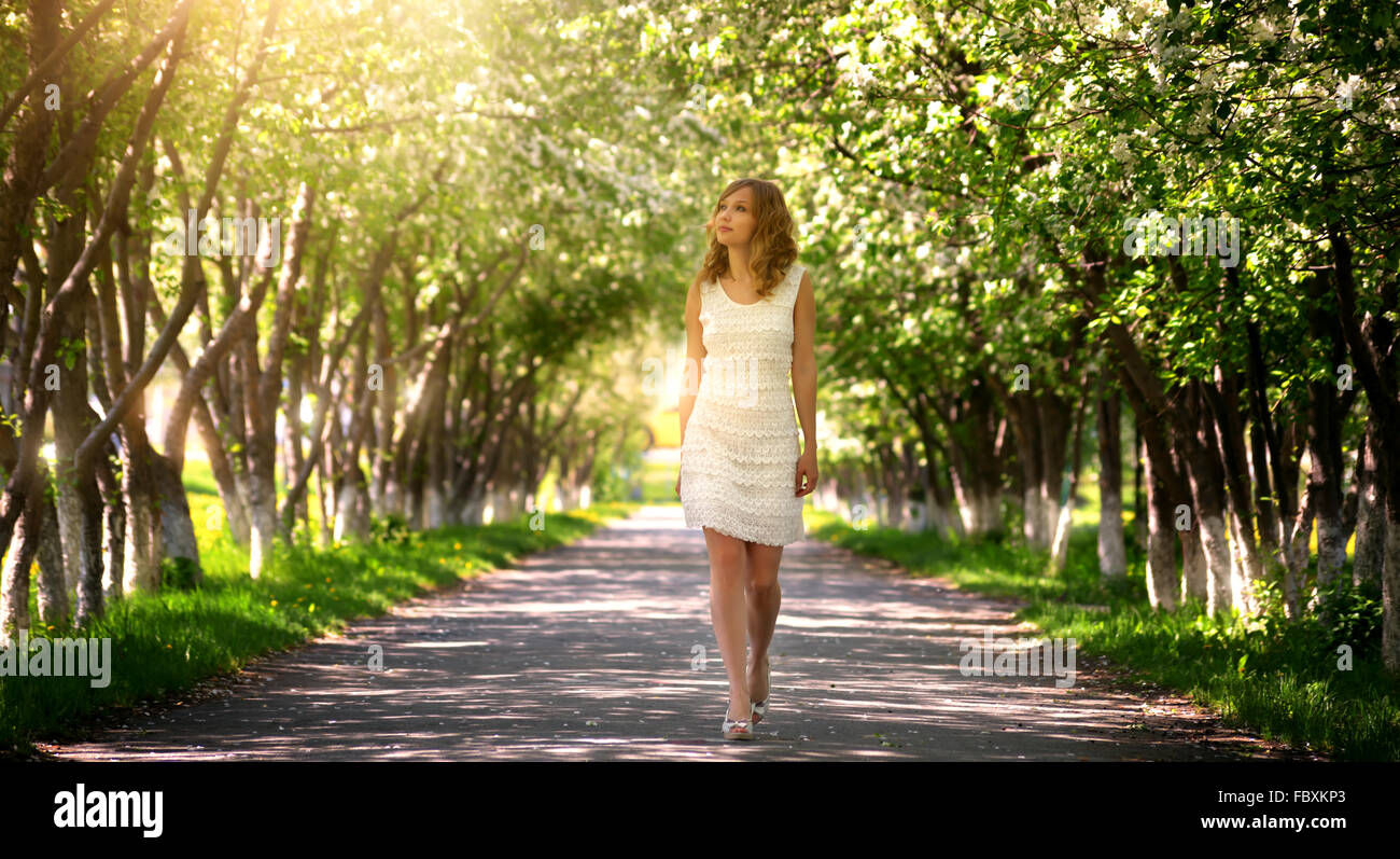 Girl walking in the park Stock Photo - Alamy