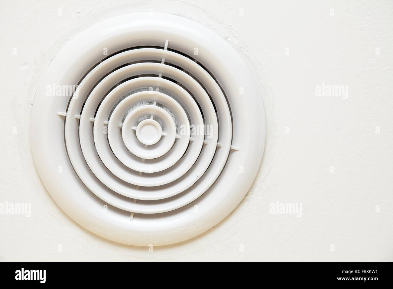 circular plastic air vent in white wall Stock Photo Alamy