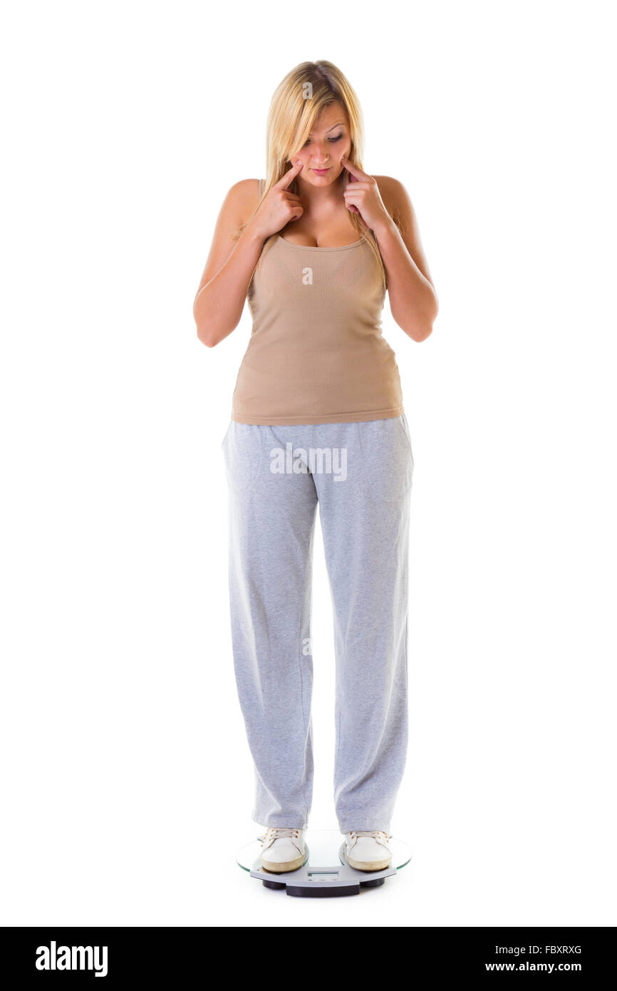 Large girl with weight scale hi-res stock photography and images