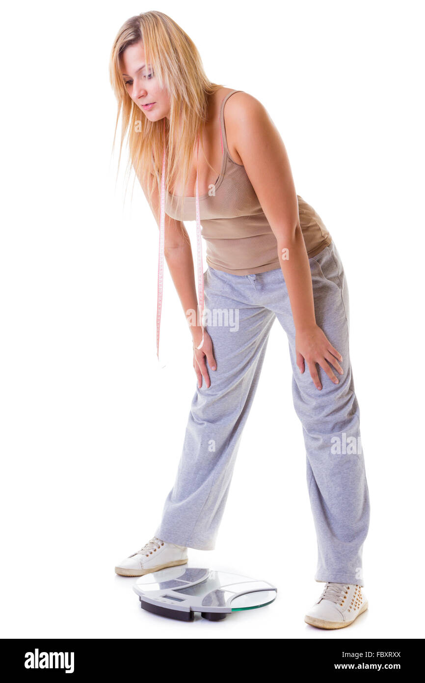 Woman wearing tight clothes on grey background, closeup. Overweight problem  Stock Photo