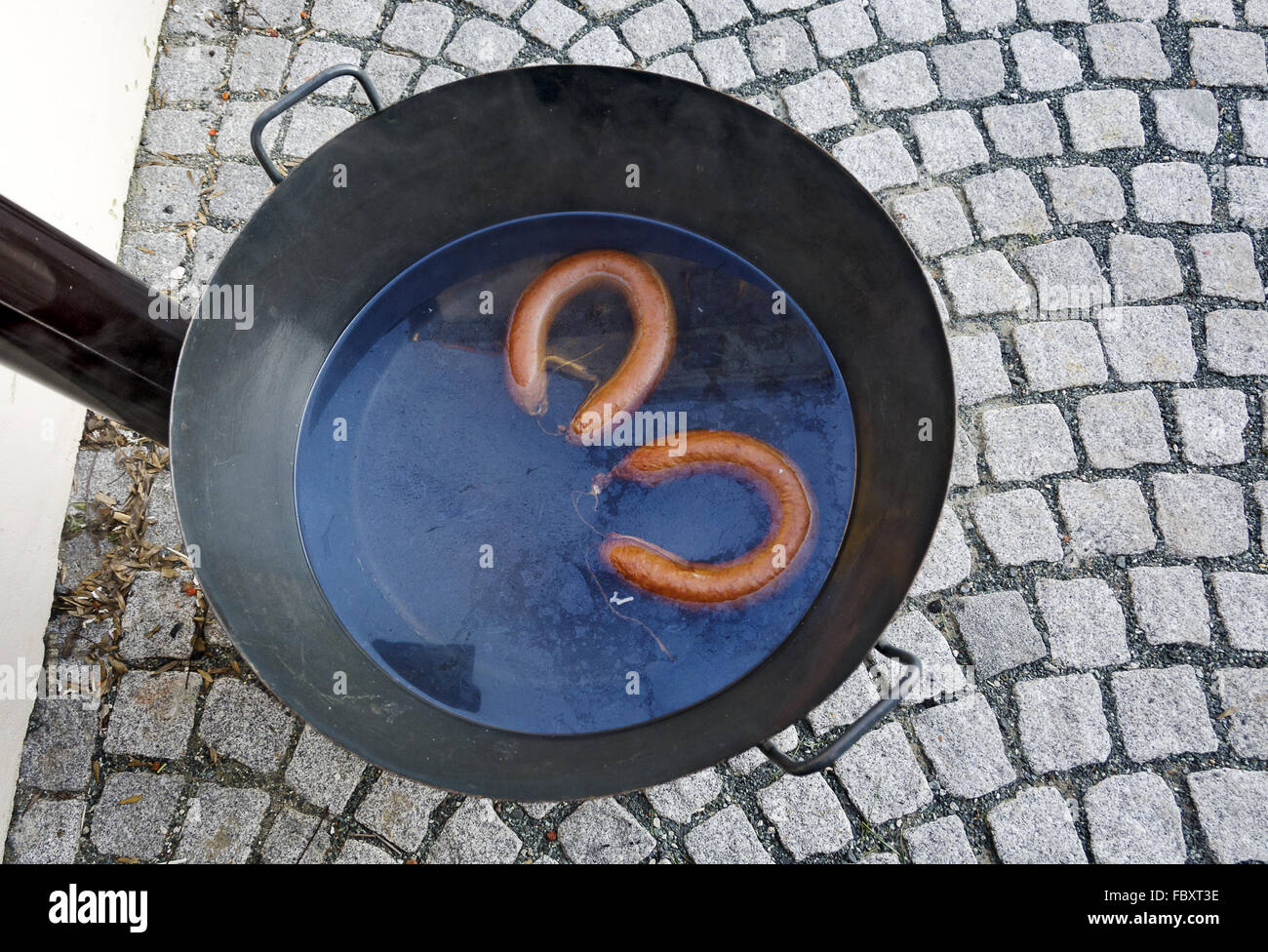 hot sausages in a cauldron Stock Photo Alamy