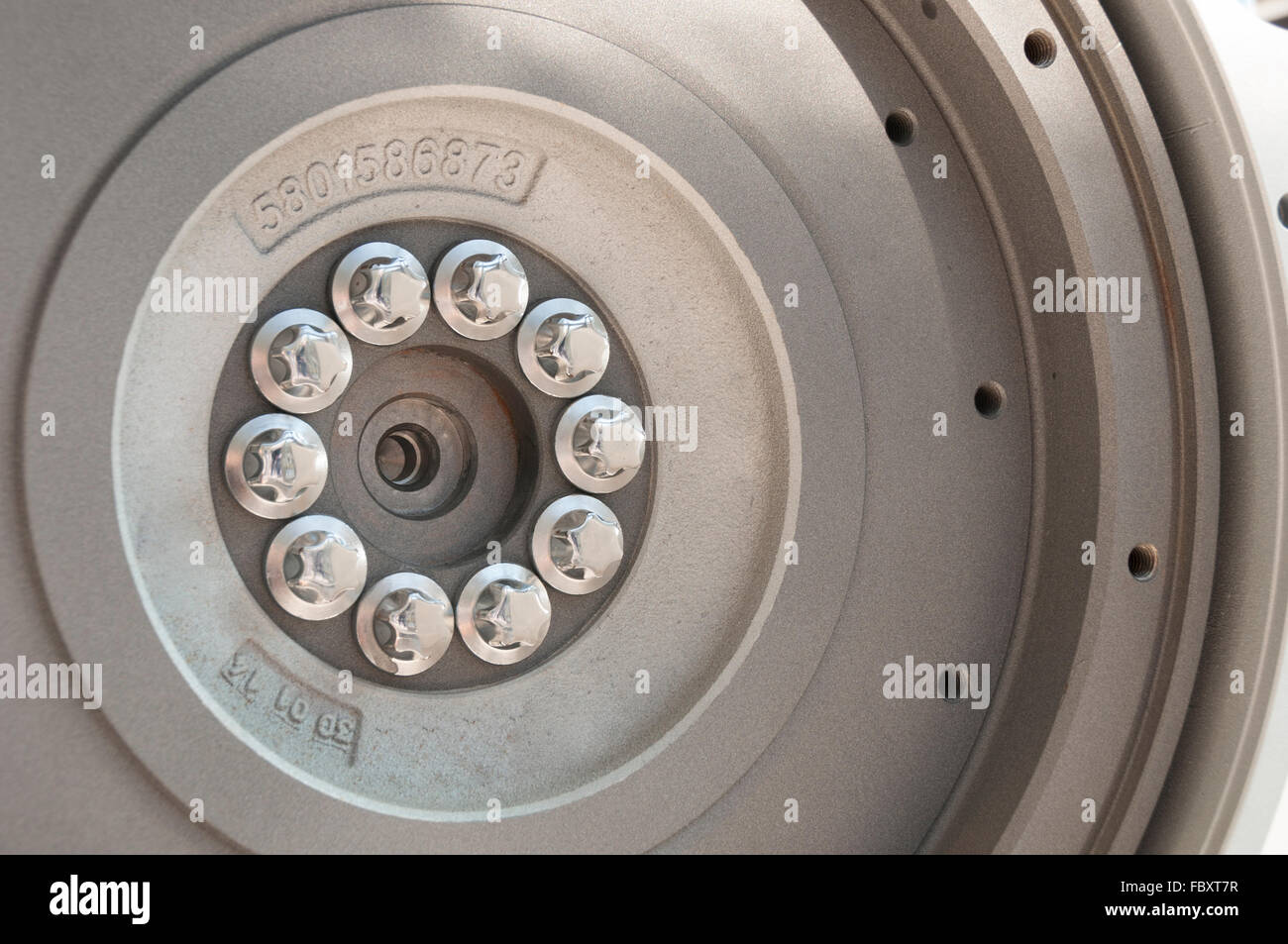 Detail of flywheel on the modern tractor engine Stock Photo Alamy