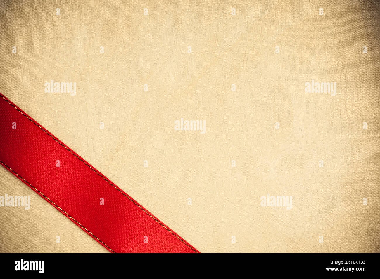 Shiny red ribbon stripe on bright cloth background Stock Photo - Alamy