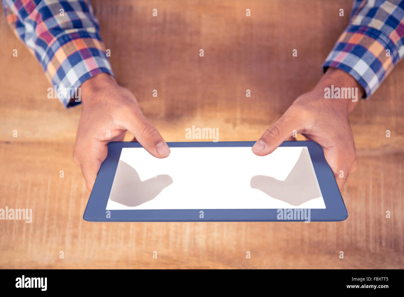 Cropped image of hands using tablet PC Stock Photo