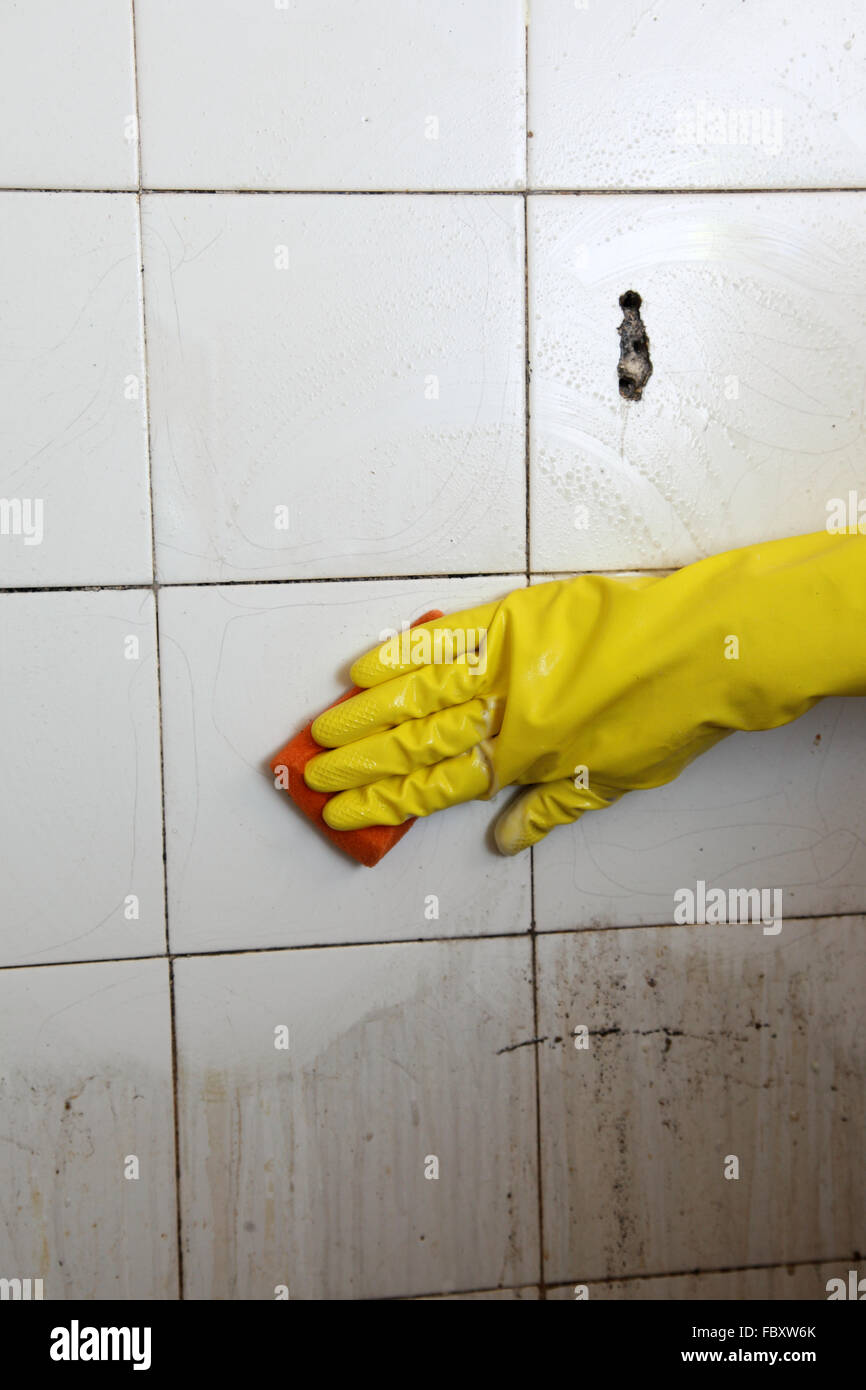 Cleaning dirty old tiles in hires stock photography and images Alamy