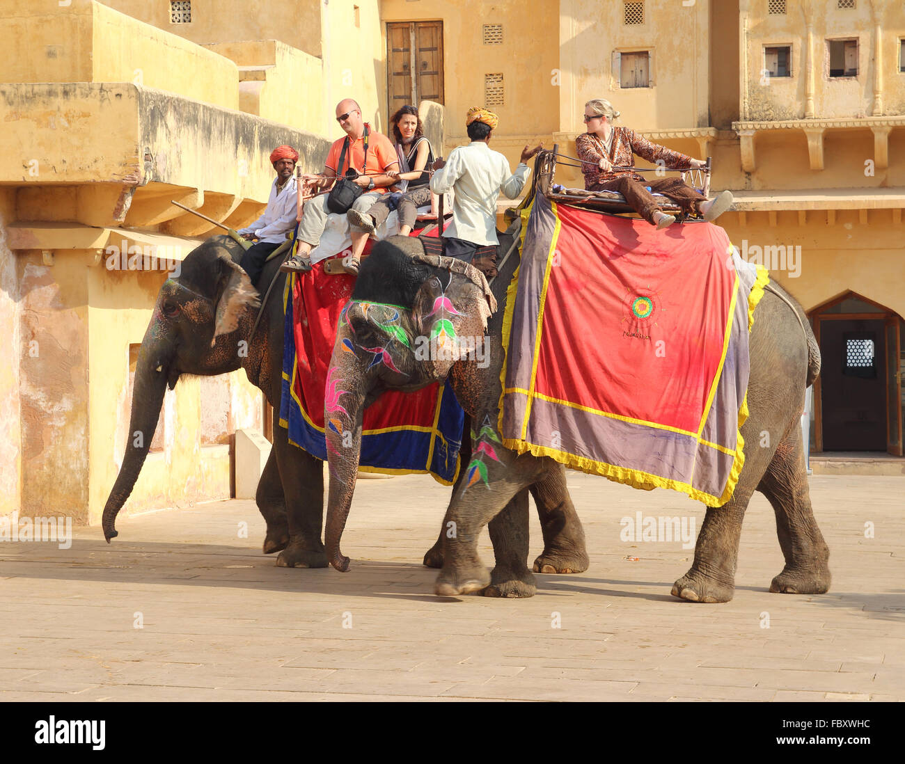 tourists on elephants in Jaipur fort India Stock Photo