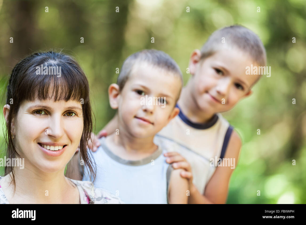 Mother and sons walking outdoor Stock Photo
