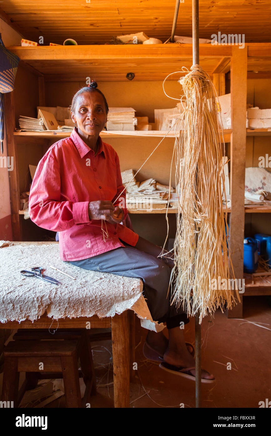 Woman making Antemoro parchment paper from bark fibre of Havoha tree, Ambalavao, Madagascar Stock Photo