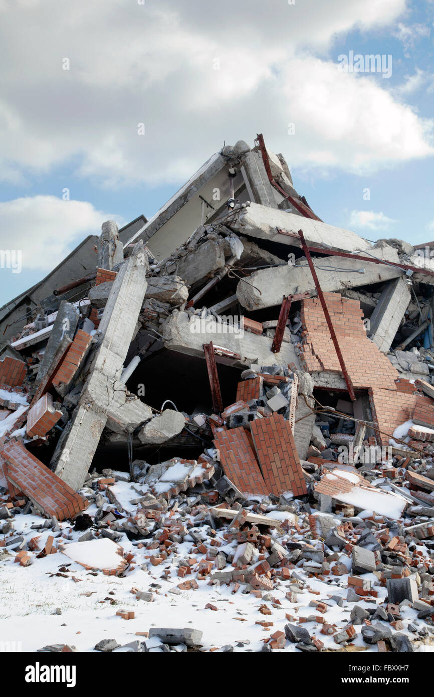 Rubble pile of wrecked building, blue sky and clouds, 2015. Stock Photo