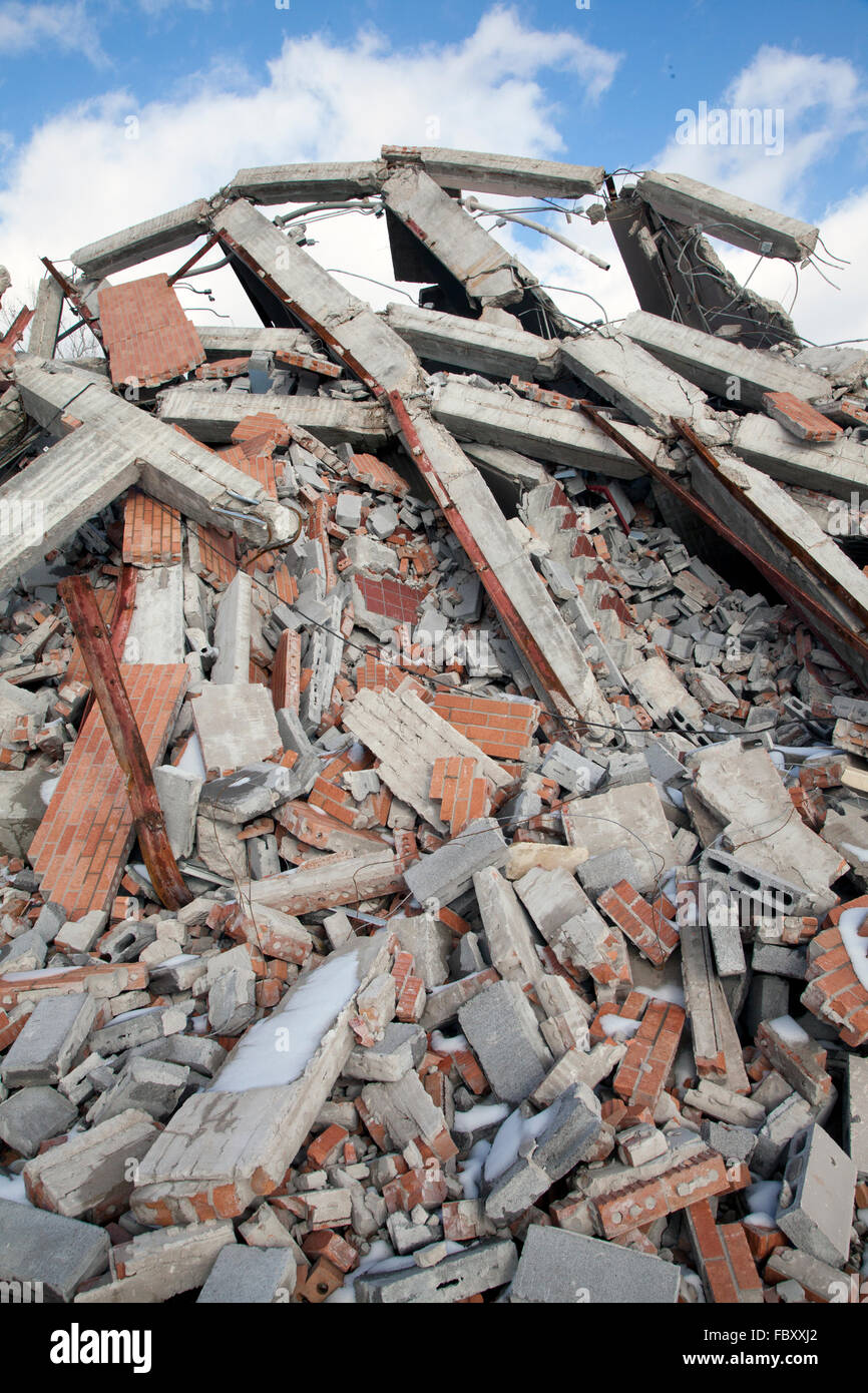 Rubble pile of wrecked building, blue sky and clouds, 2015. Stock Photo