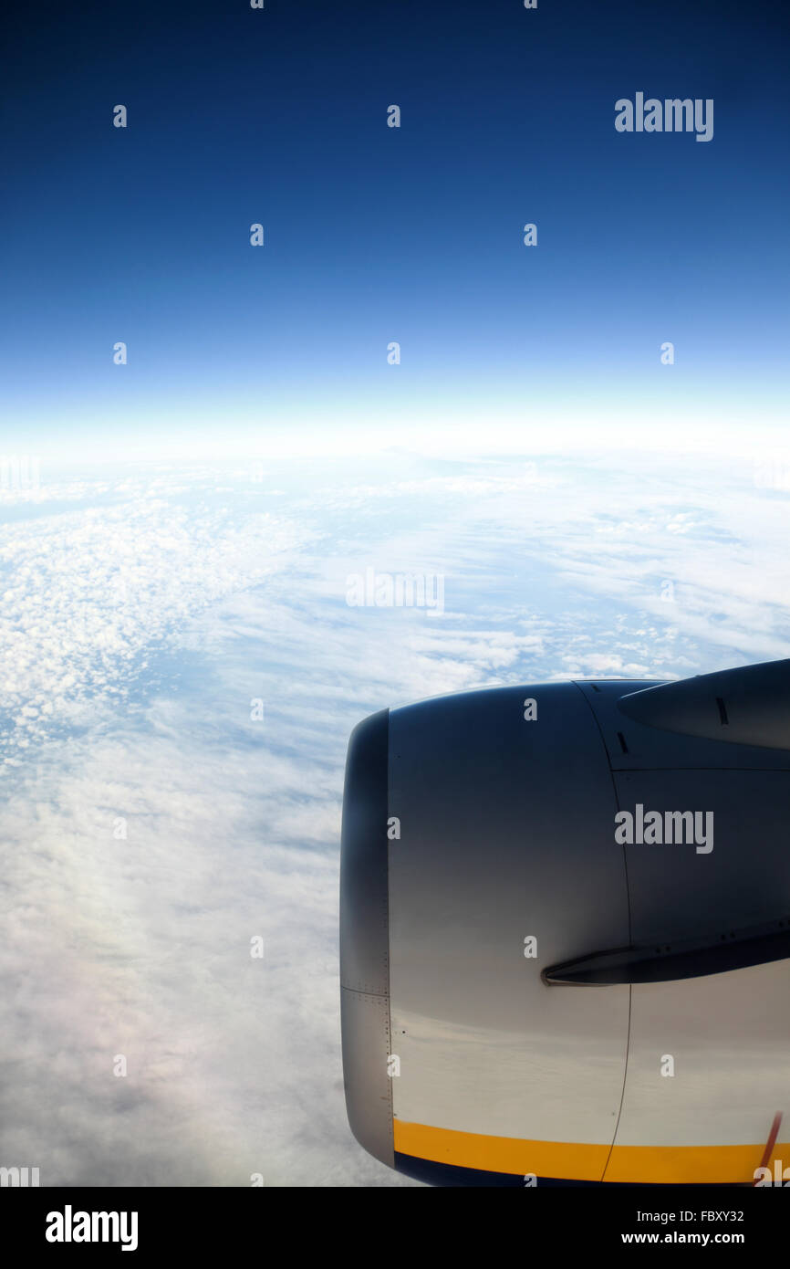 Airplane in the blue sky white clouds Stock Photo - Alamy
