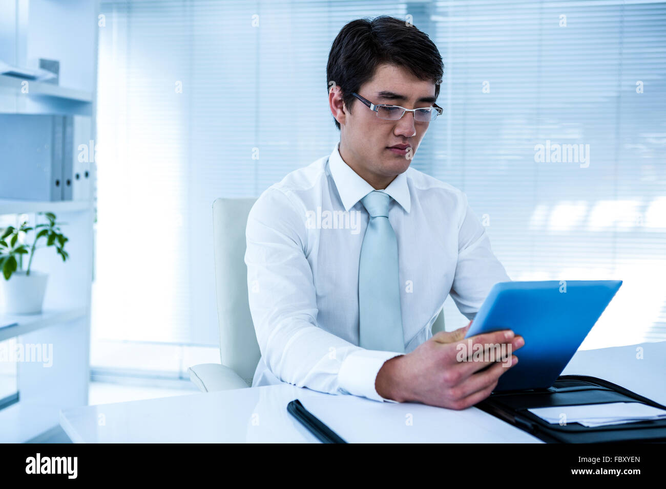 Serious asian male computer hi-res stock photography and images - Alamy