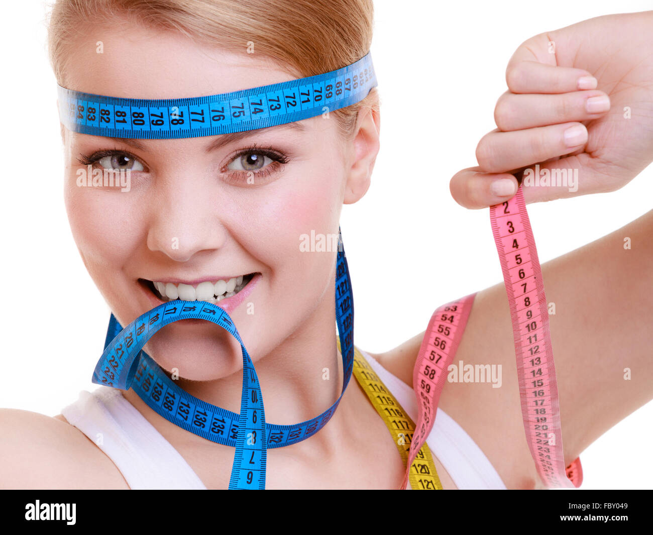 sporty fit woman with measure tapes. Time for diet slimming Stock Photo