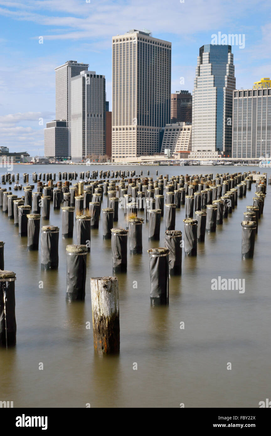 Old pier pylons and Downtown Manhattan, New York City Stock Photo Alamy