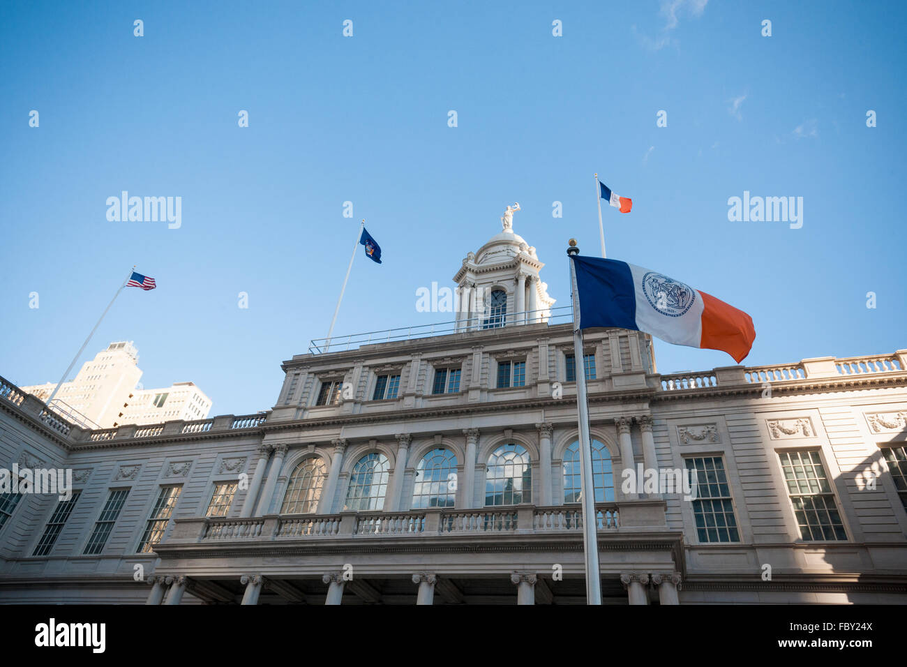 Flags fly in the cold wind in front of New York City Hall on Tuesday, January 19, 2016. (© Richard B. Levine) Stock Photo