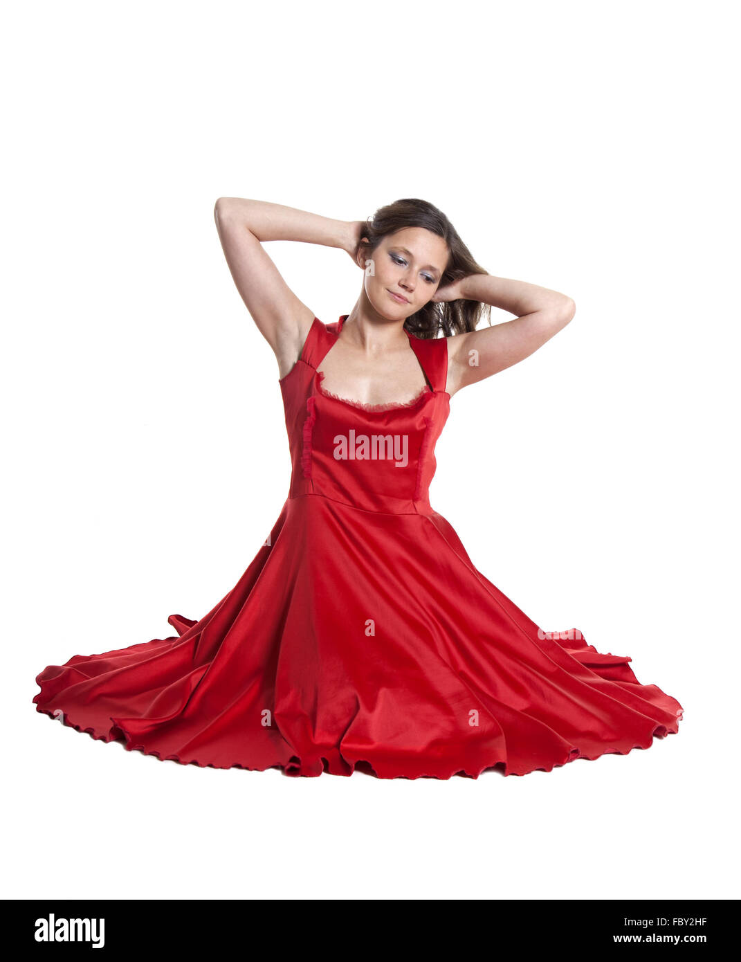 Beautiful woman sitting on the floor Stock Photo - Alamy