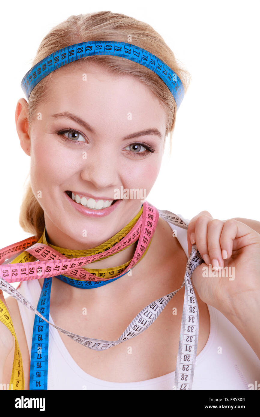 sporty fit woman with measure tapes. Time for diet slimming. Stock Photo