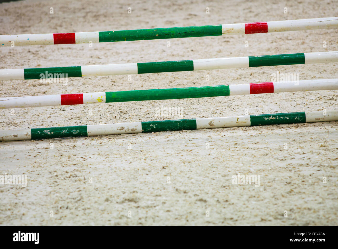 Green red white obstacle for jumping horses. Riding competition. Stock Photo