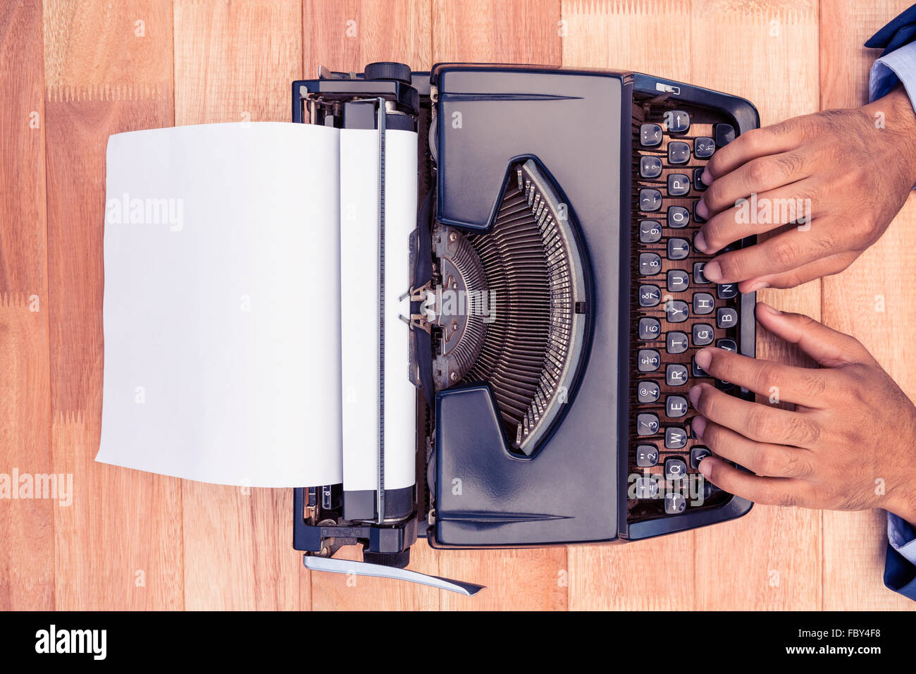 Businessman typing on typewriter Stock Photo