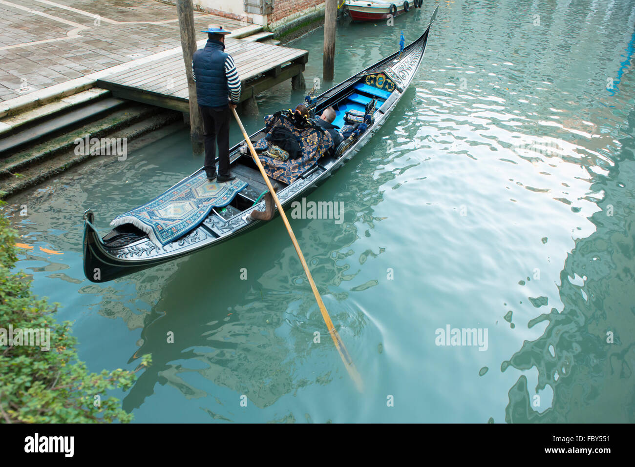 a gondola on a canal in Venice Stock Photo - Alamy
