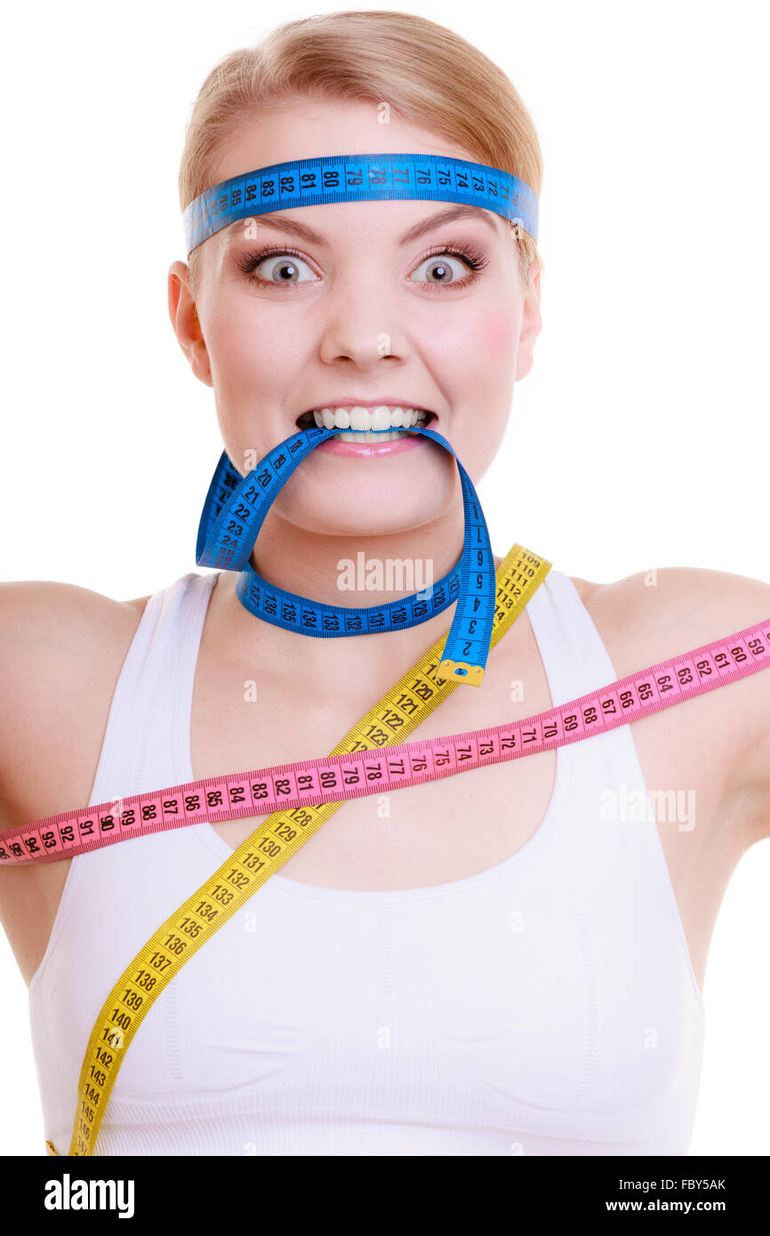 Obsessed sporty fit woman with measure tapes. Time for diet slimming. Stock Photo