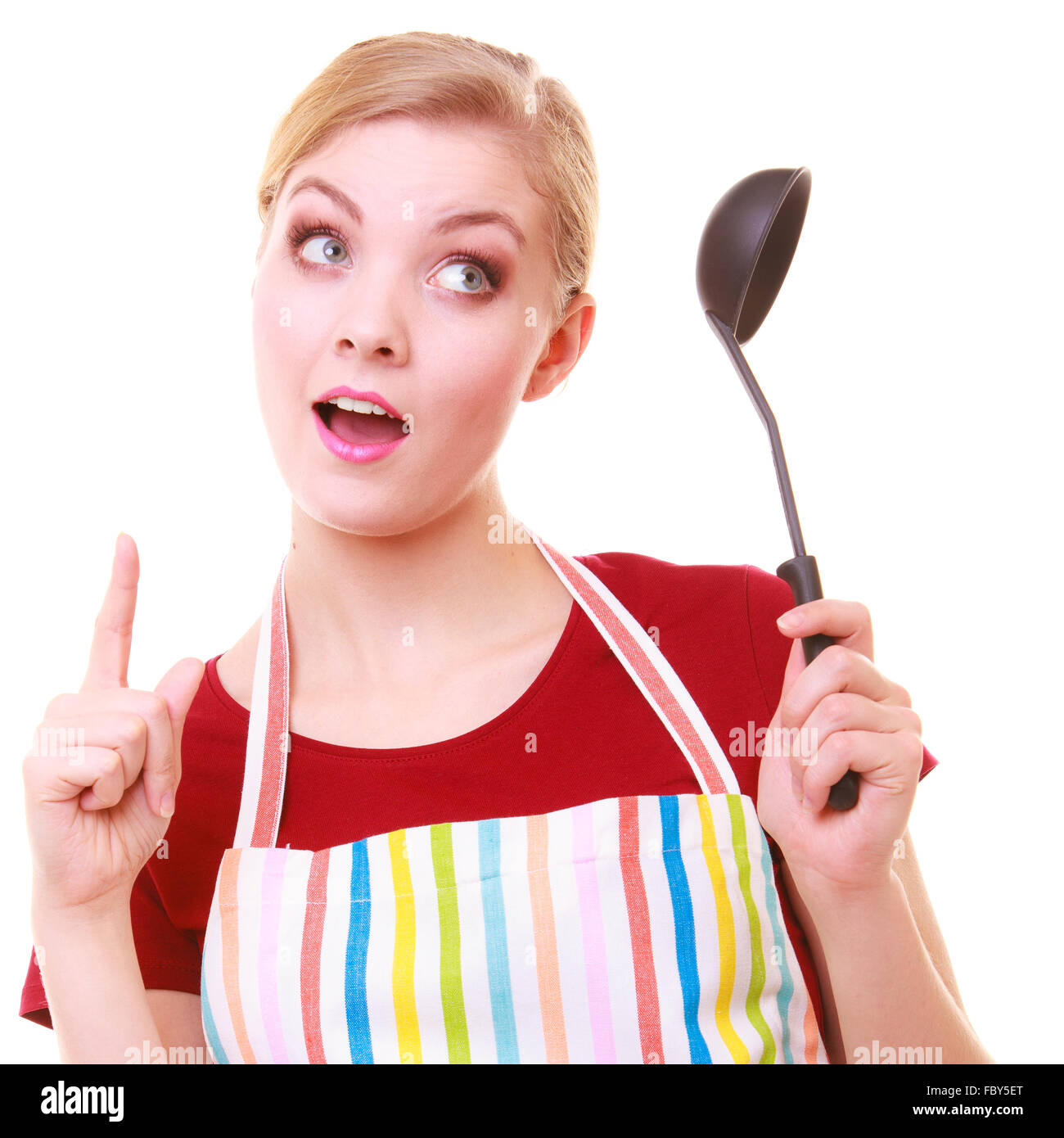 Funny housewife or cook chef in colorful kitchen apron with ladle Stock
