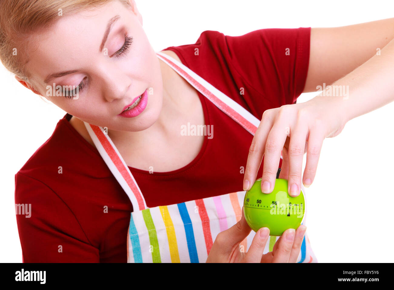 Housewife or chef in kitchen apron using apple timer isolated Stock Photo