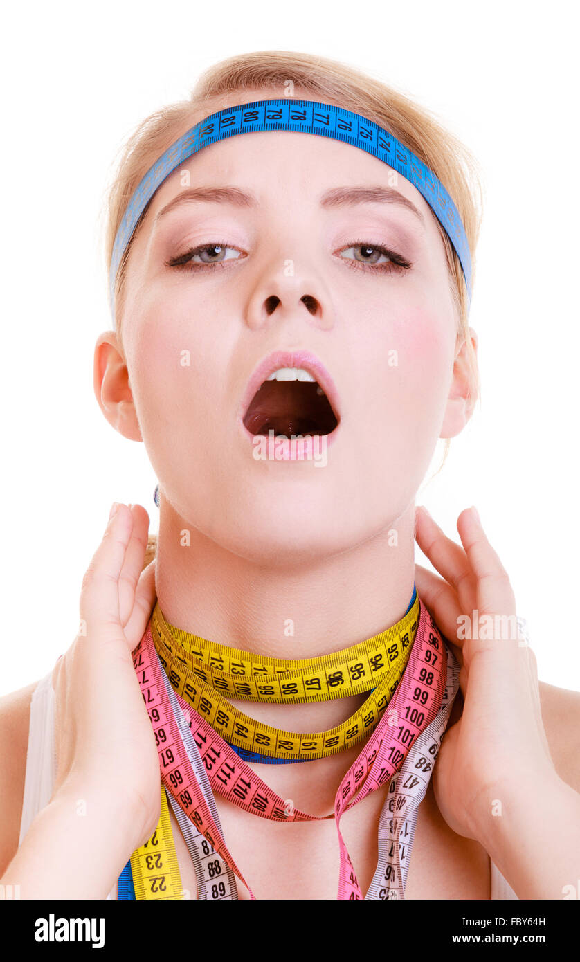 Obsessed sporty fit woman with measure tapes. Time for diet slimming. Stock Photo